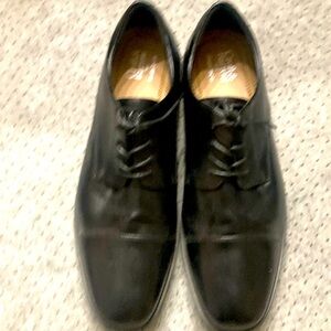 Men’s black dress shoes.